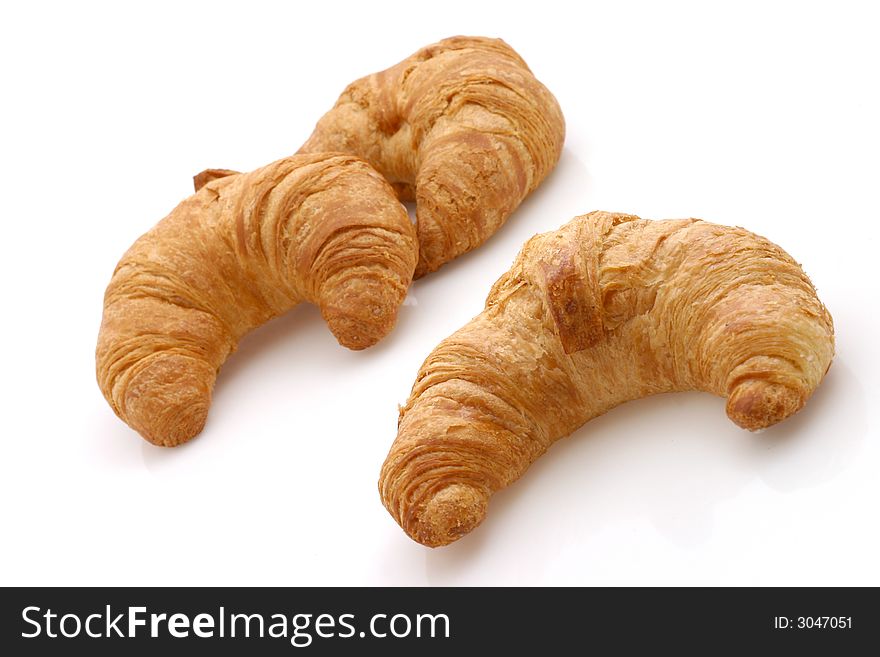 Fresh croissants on white background