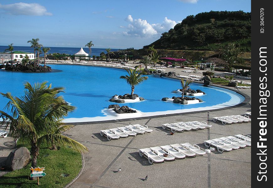 Swimming pool near the Atlantic ocean and blue sky. Swimming pool near the Atlantic ocean and blue sky