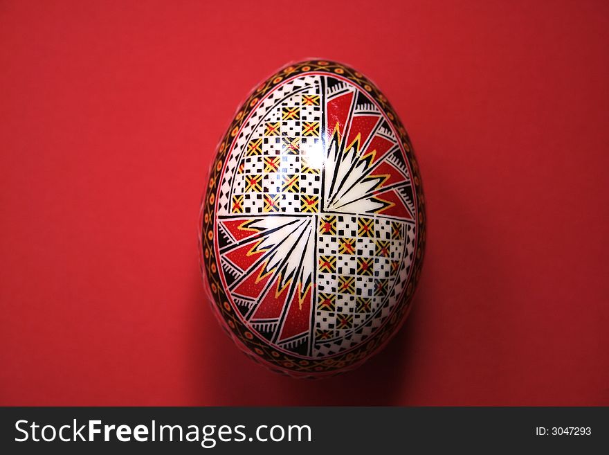One easter egg isolated on red