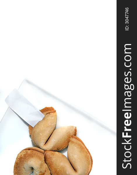 Fortune cookies on a white plate and white background. Fortune cookies on a white plate and white background.