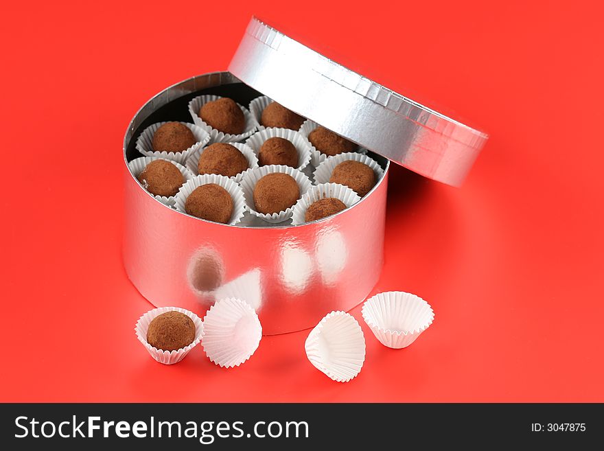 Cookies in silver box on the red background