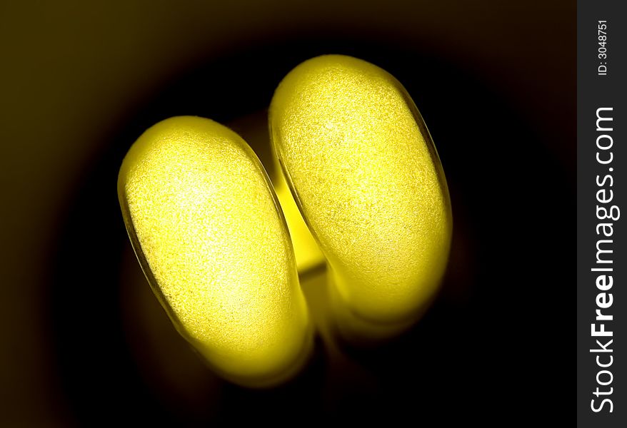 Yellow economic and energy saver electrical bulb. Yellow economic and energy saver electrical bulb
