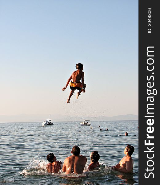 3..2..1...Liftoff!! Group of beachgoers sends a kid flying high!. ...3..2..1...Liftoff!! Group of beachgoers sends a kid flying high!