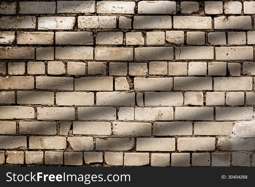 Diagonal shadow lines on brick wall pattern