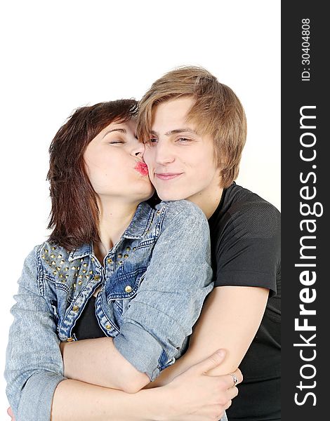 Young love couple kissing over white background, valentine day concept. Young love couple kissing over white background, valentine day concept