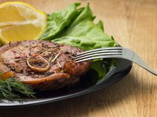 Grilled Steak With Salad And Lemon On Black Plate With Fork Royalty Free Stock Images Grilled Steak With Salad And Lemon On Black Plate With Fork Royalty Free Stock Images