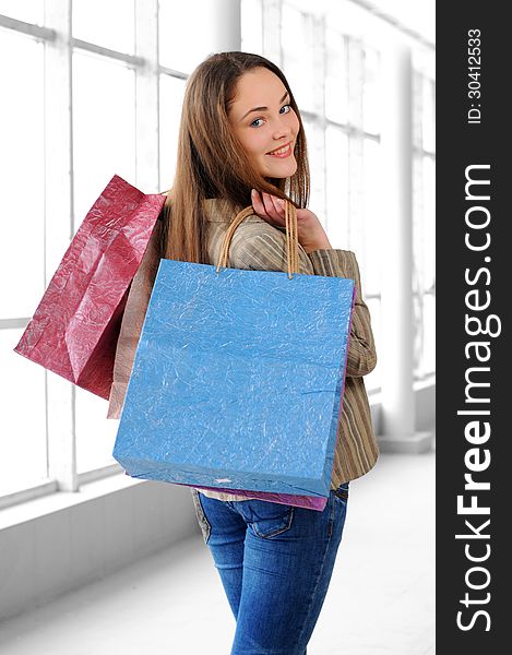 Portrait of a young girl with bags for shopping. Portrait of a young girl with bags for shopping