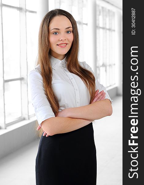 Portrait of a young girl in a business office. Portrait of a young girl in a business office