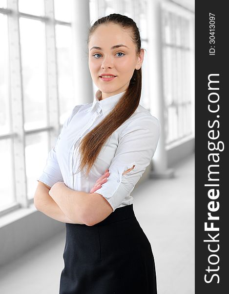 Portrait of a young girl in a business office. Portrait of a young girl in a business office