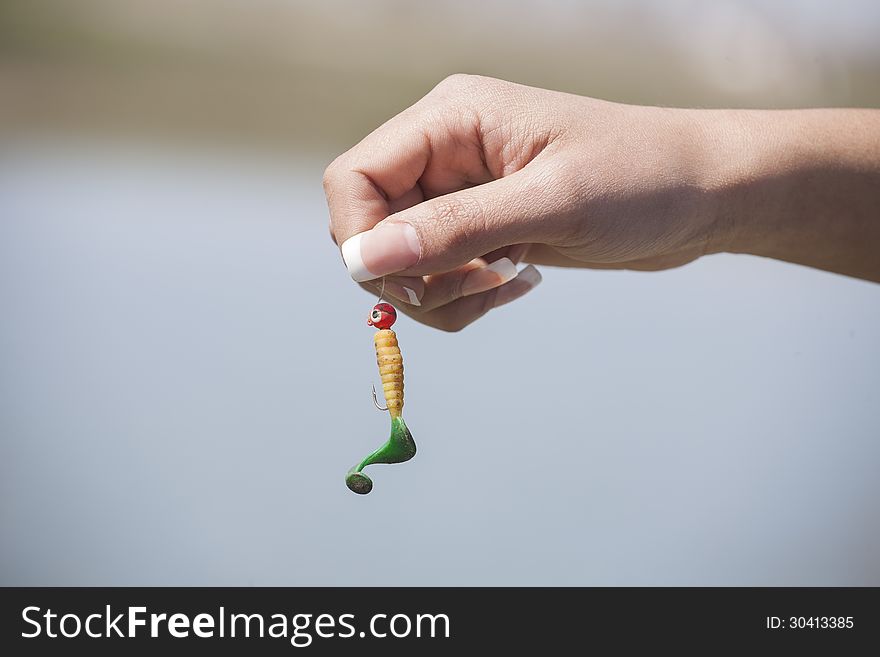 Hook bait in a female hand