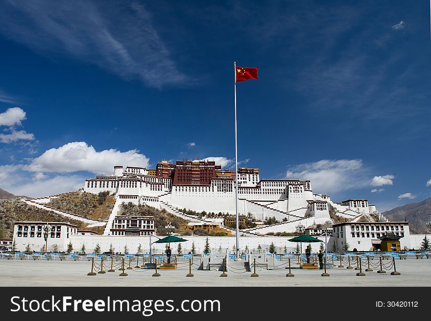 Potala Palace in Lhasa, Tibet. The Chinese flag in the foreground is like a symbol for the current development.