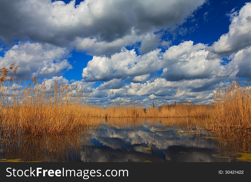 Dramatic Storm Sky And Ominous Clouds Over Lake In April