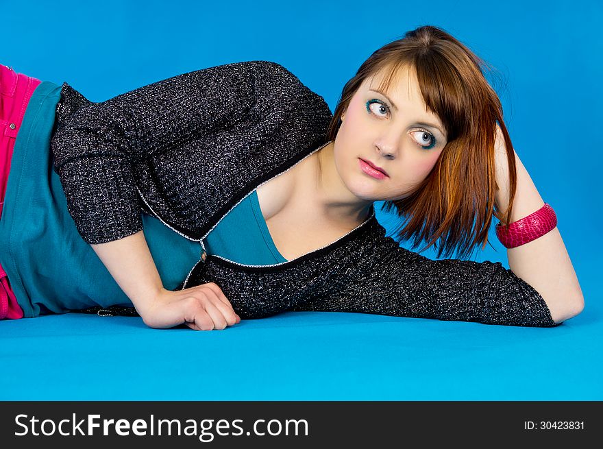 Portrait Redhead Girl On A Blue Background