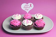 Pink Ribbon Day Message Across White Heart Toppers On Pink And White Decorated Red Velvet Cupcakes Royalty Free Stock Photos Pink Ribbon Day Message Across White Heart Toppers On Pink And White Decorated Red Velvet Cupcakes Royalty Free Stock Photos