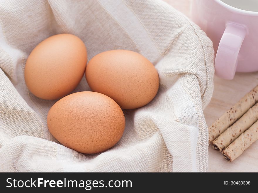 Three eggs isolated on fabric background