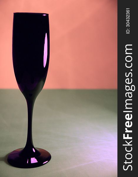 Black Wine Glass isolated on Pink and Gray Background. Black Wine Glass isolated on Pink and Gray Background