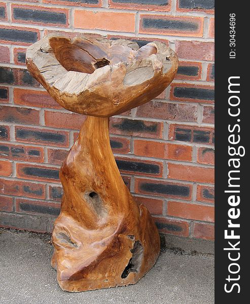A Free Standing Chunky Wooden Display Bowl.