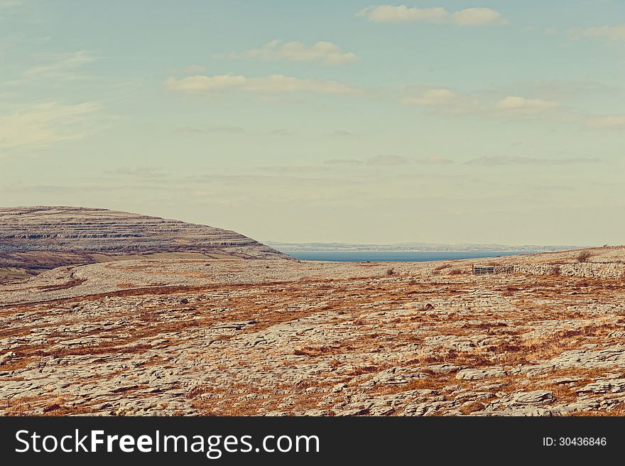 The rolling hills of Burren and Atlantic Ocean