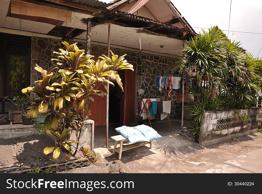 Pillows and a clothesline in front of house