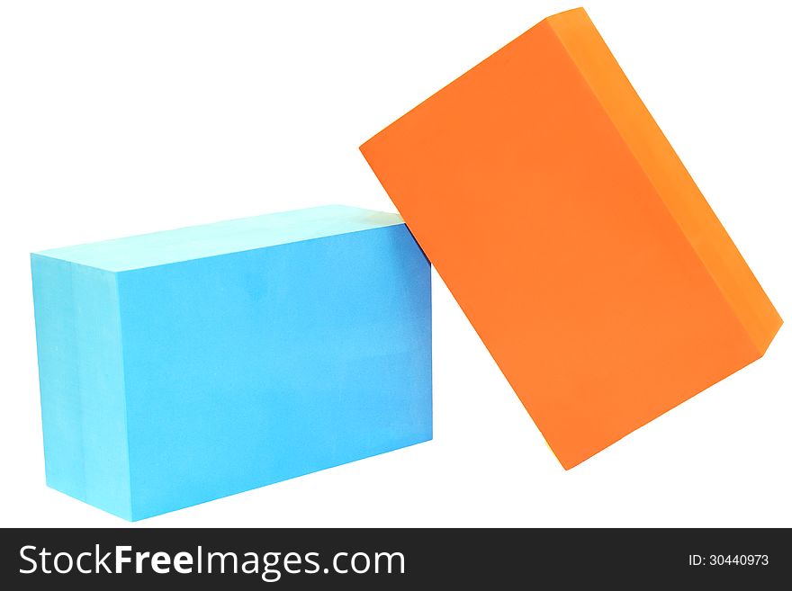 blue and orange yoga blocks on white isolated. blue and orange yoga blocks on white isolated