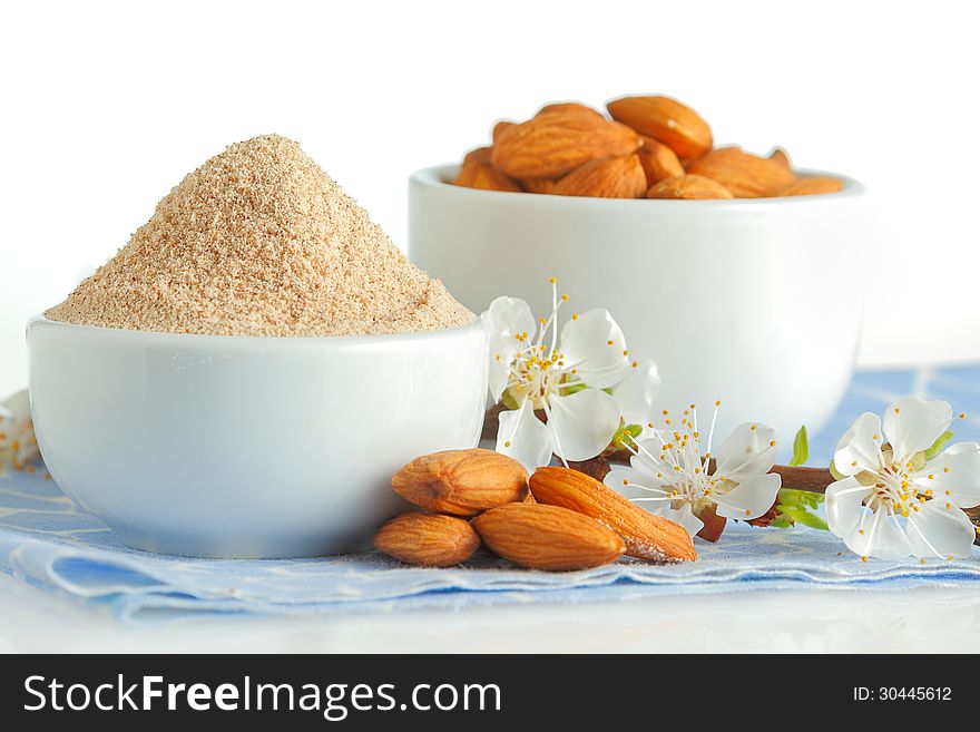 Almond flour and nuts on blue napkin