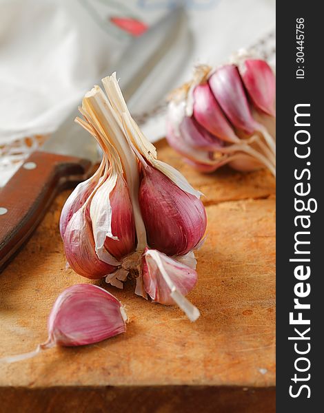 Fresh garlic on wooden table, selective focus