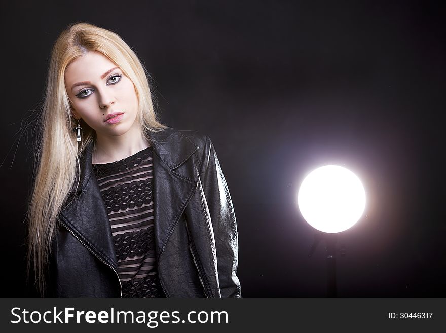 Gorgeous blonde with a light behind her and lans flare