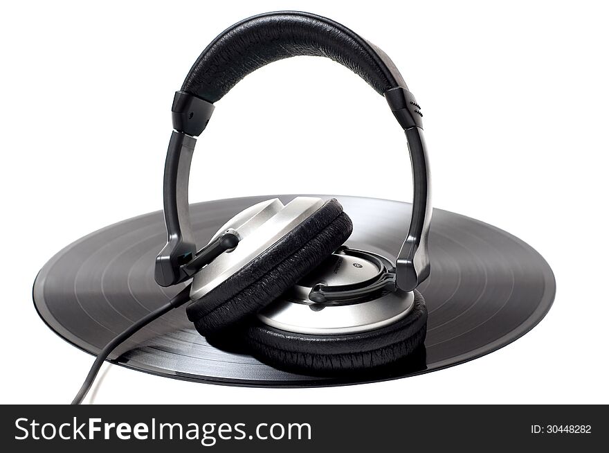 Vinyl record and headphones. Vinyl record and headphones.