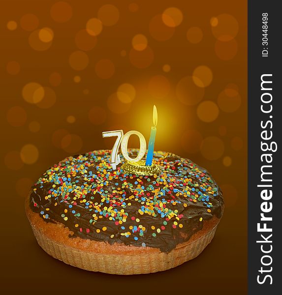 Seventy birthday cake on brown background. Seventy birthday cake on brown background