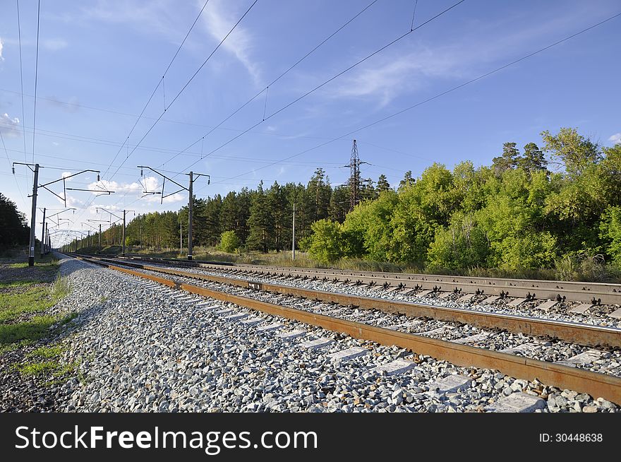 Railway on background of the forest landscape. Railway on background of the forest landscape.
