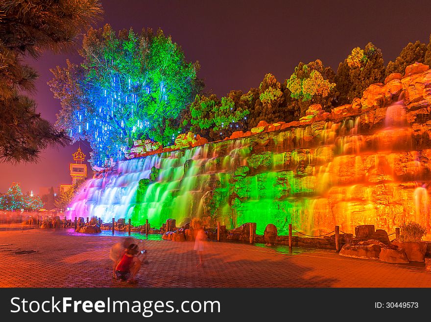 The image taken in china`s hebei province,qinhuangdao city,beidaihe district.At night colored lights illuminate the falls and create a charming turn away from. The image taken in china`s hebei province,qinhuangdao city,beidaihe district.At night colored lights illuminate the falls and create a charming turn away from.