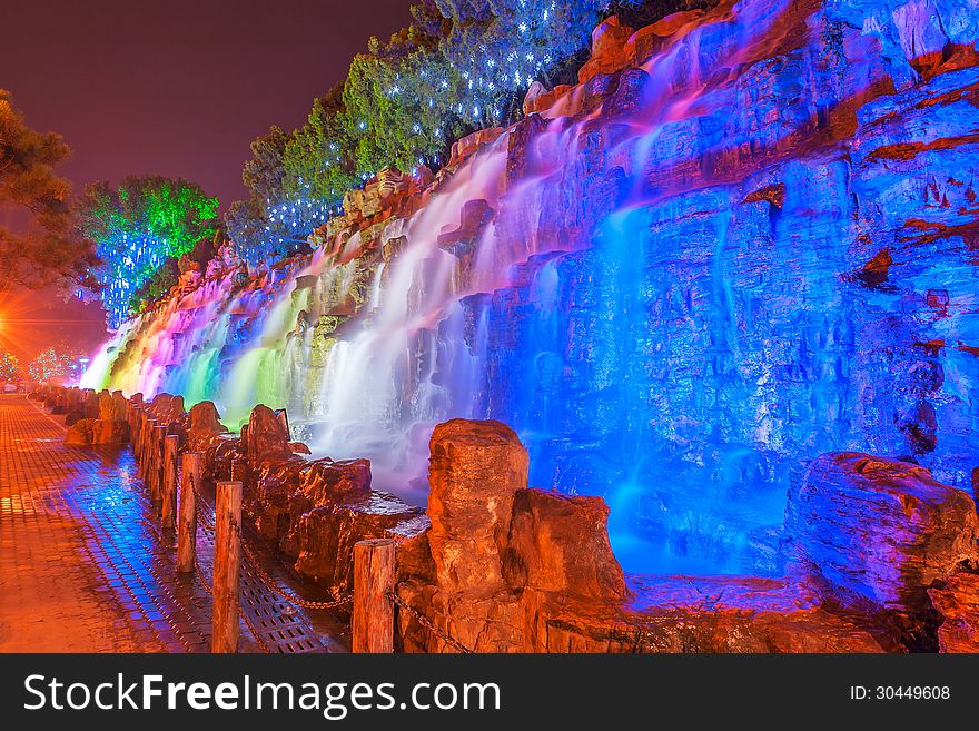 The image taken in china`s hebei province,qinhuangdao city,beidaihe district.At night colored lights illuminate the falls and create a charming turn away from. The image taken in china`s hebei province,qinhuangdao city,beidaihe district.At night colored lights illuminate the falls and create a charming turn away from.