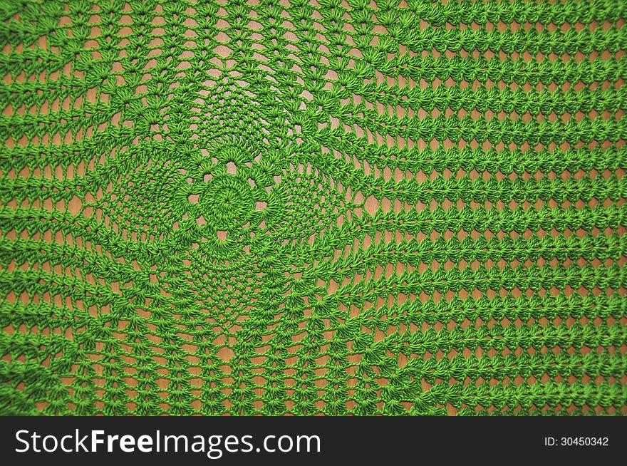 Background of a green knitted fabric handmade. Background of a green knitted fabric handmade.