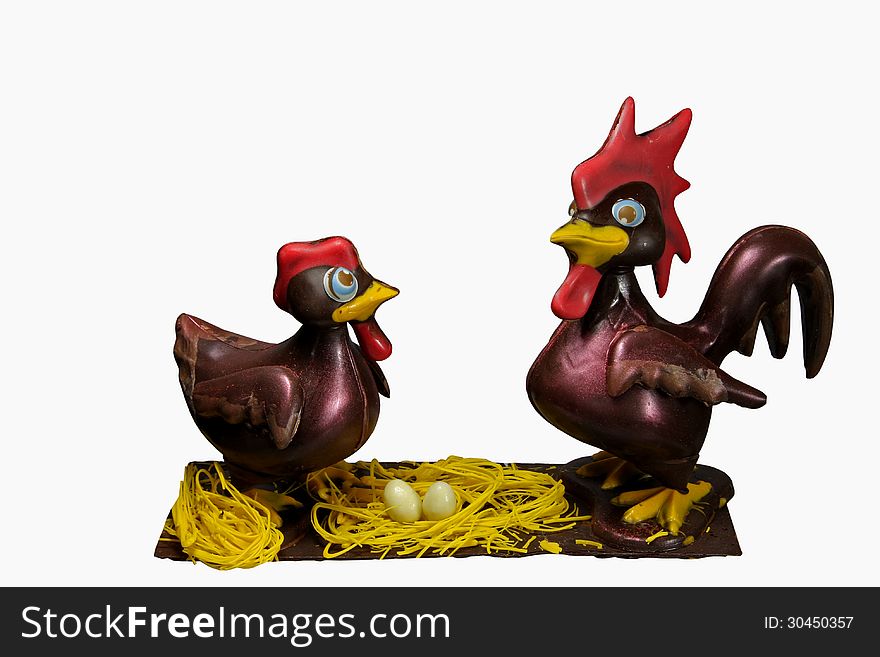 Fun hen and rooster on nest made of chocolate. Fun hen and rooster on nest made of chocolate