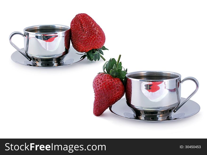Two cups of coffee and fresh sweet strawberry against white background. Two cups of coffee and fresh sweet strawberry against white background.