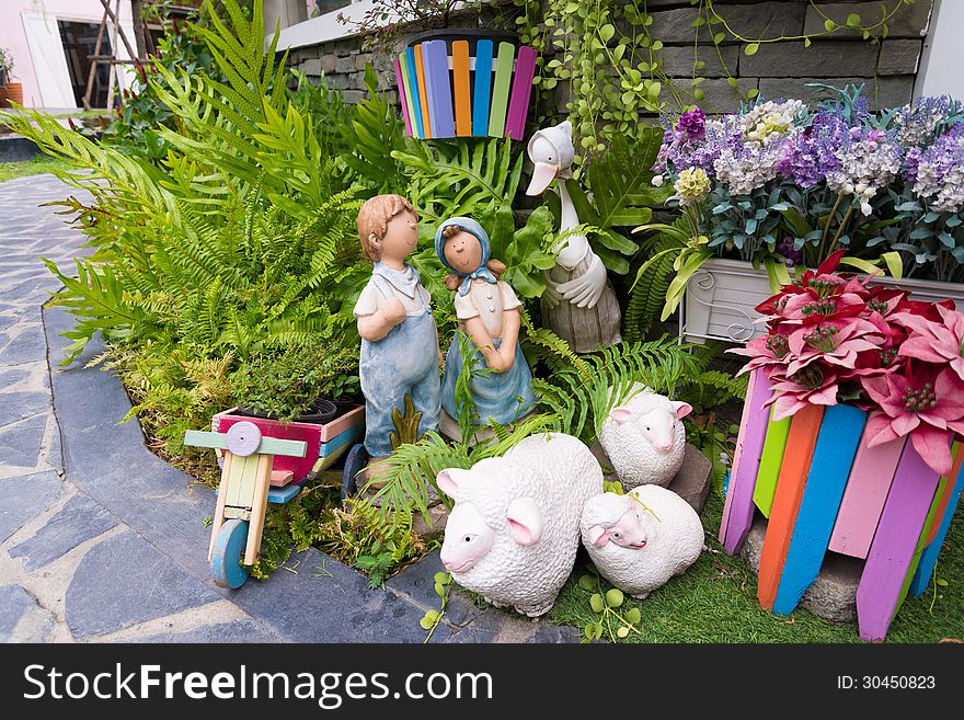 Ceramic decorate dolls and small tree garden