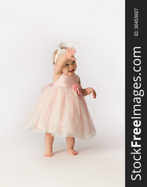 Little Girl In Frilly Dress Waving