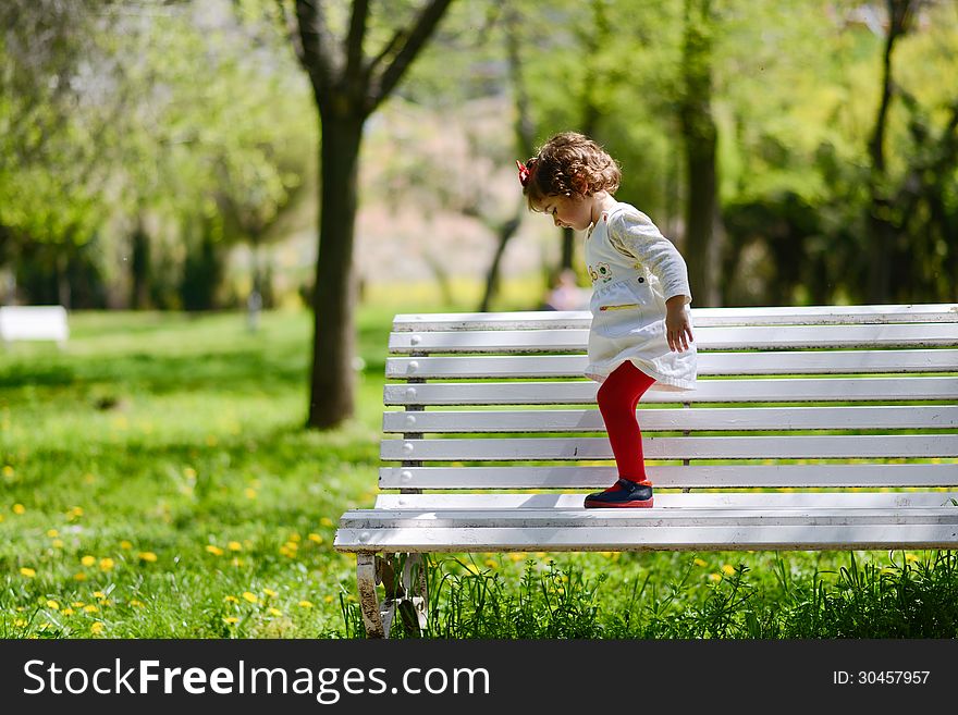 Portrait of a little girl playing in the park