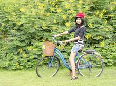 Smiling Girl Riding A Bicycle In The Park Stock Photo Smiling Girl Riding A Bicycle In The Park Stock Photo