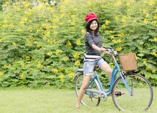 Young Woman On A Green Meadow With A Bicycle Royalty Free Stock Photos Young Woman On A Green Meadow With A Bicycle Royalty Free Stock Photos