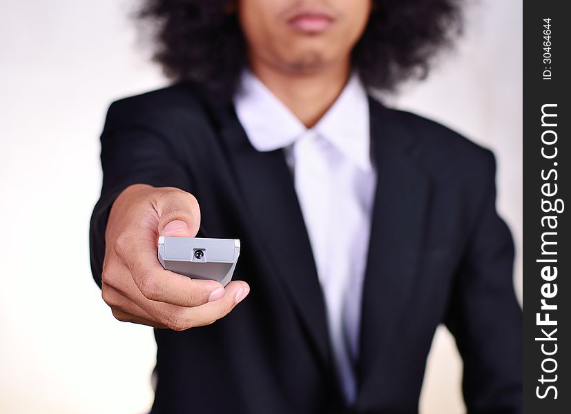 Close up a man holding remote control