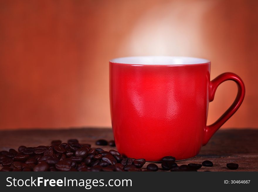 Close up red cup coffee on wood background