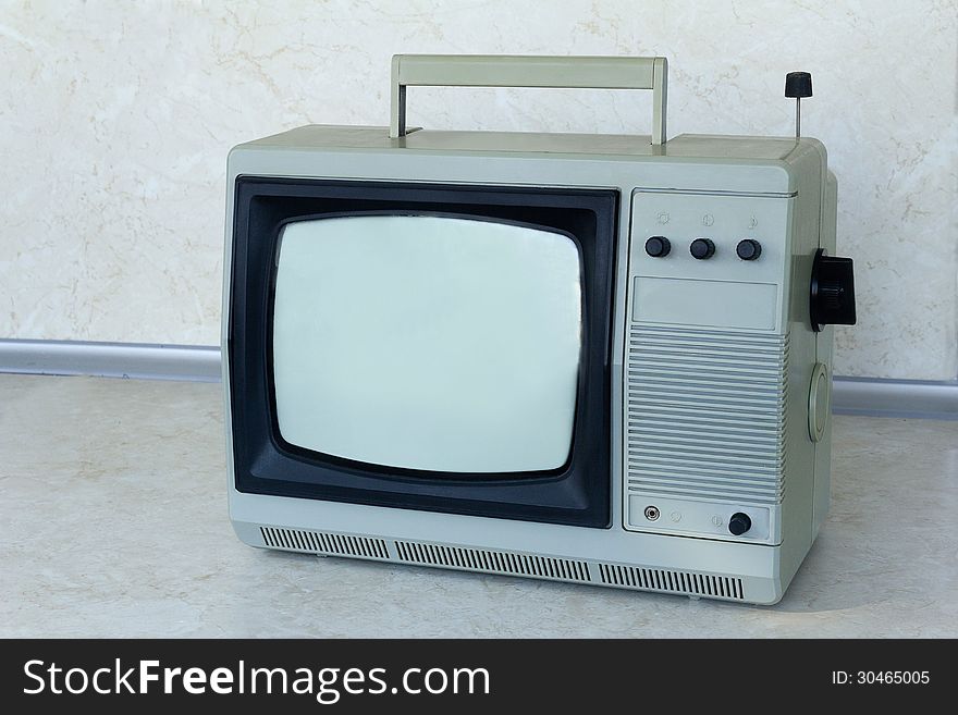 A small portable compact TV gray, an obsolete model Ð²Ñ‹Ð¿ÑƒÑÐºÐ°Ð²ÑˆÐ°ÑÑÑ about thirty years ago. A small portable compact TV gray, an obsolete model Ð²Ñ‹Ð¿ÑƒÑÐºÐ°Ð²ÑˆÐ°ÑÑÑ about thirty years ago