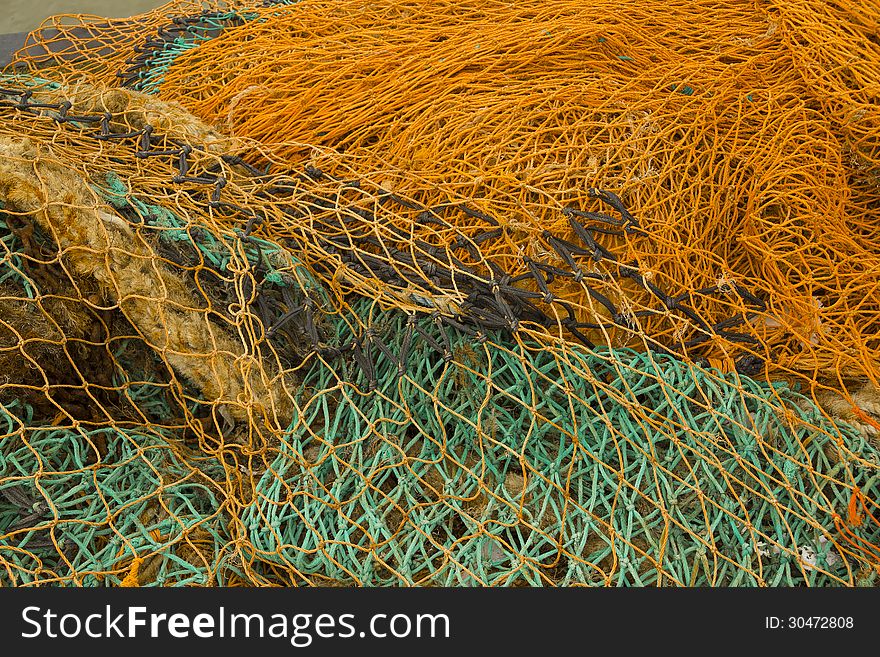 Close up of vibrant fishing nets used in local harbour