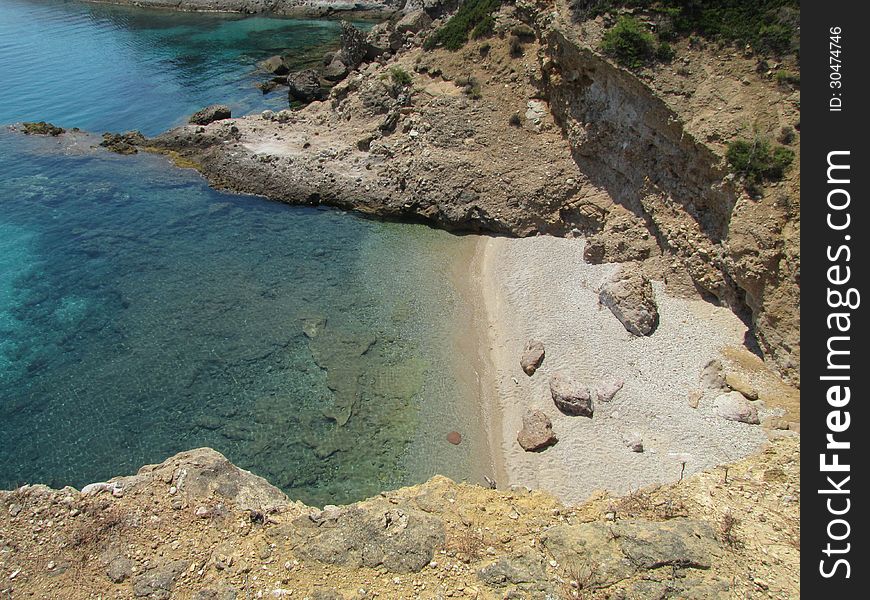 Empty, small beach hidden among big rocks, Thassos Island, Greece. Empty, small beach hidden among big rocks, Thassos Island, Greece