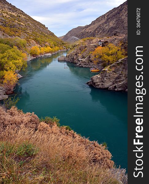 View of the Kawarau Gorge River, Otago, New Zealand. Popular with tourists for jet boating and gold panning. View of the Kawarau Gorge River, Otago, New Zealand. Popular with tourists for jet boating and gold panning.