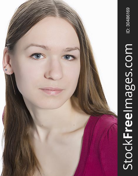 Close up portrait of young natural face, blue eyes teenager girl with long brown hair, looking straight to the camera. Isolated over white background. Close up portrait of young natural face, blue eyes teenager girl with long brown hair, looking straight to the camera. Isolated over white background.
