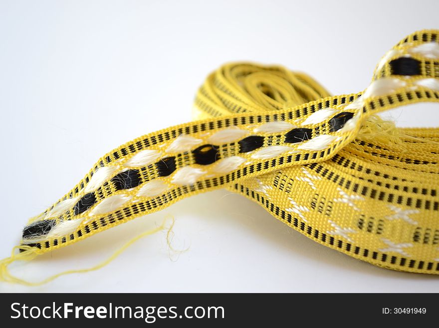 Skein of yellow tape for decoration. Skein of yellow tape for decoration