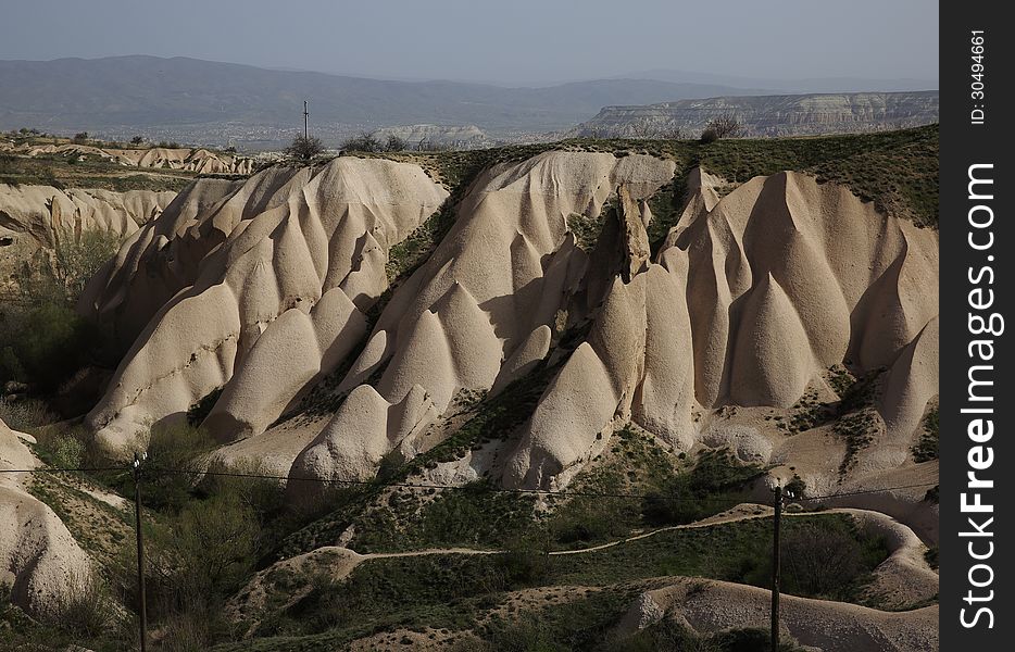 Unique geographical formations of volcanic cappadocia. Placement and protection of Christians in the former, Turkey. Unique geographical formations of volcanic cappadocia. Placement and protection of Christians in the former, Turkey