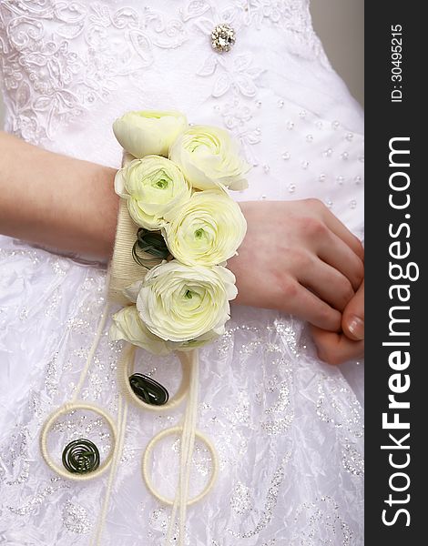 Arrangement. Bouquet of Flowers as a Bracelet on Woman&#x27;s Hands. Floristics